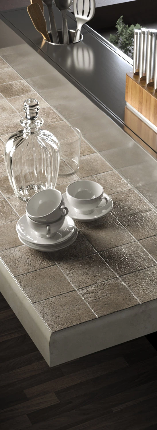 Rendering di un top cucina in pietra con caraffa di vetro e tazzine